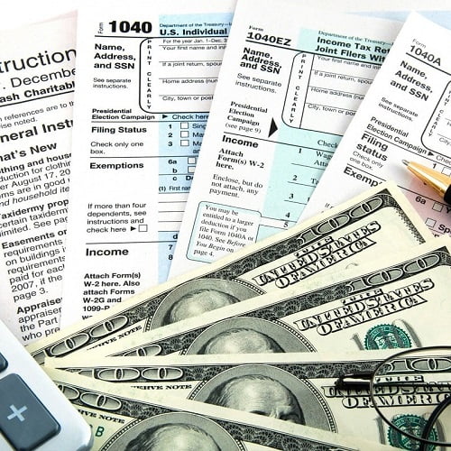 four $100 cash money on some tax forms reminding tax season In & Near Bronx, NY